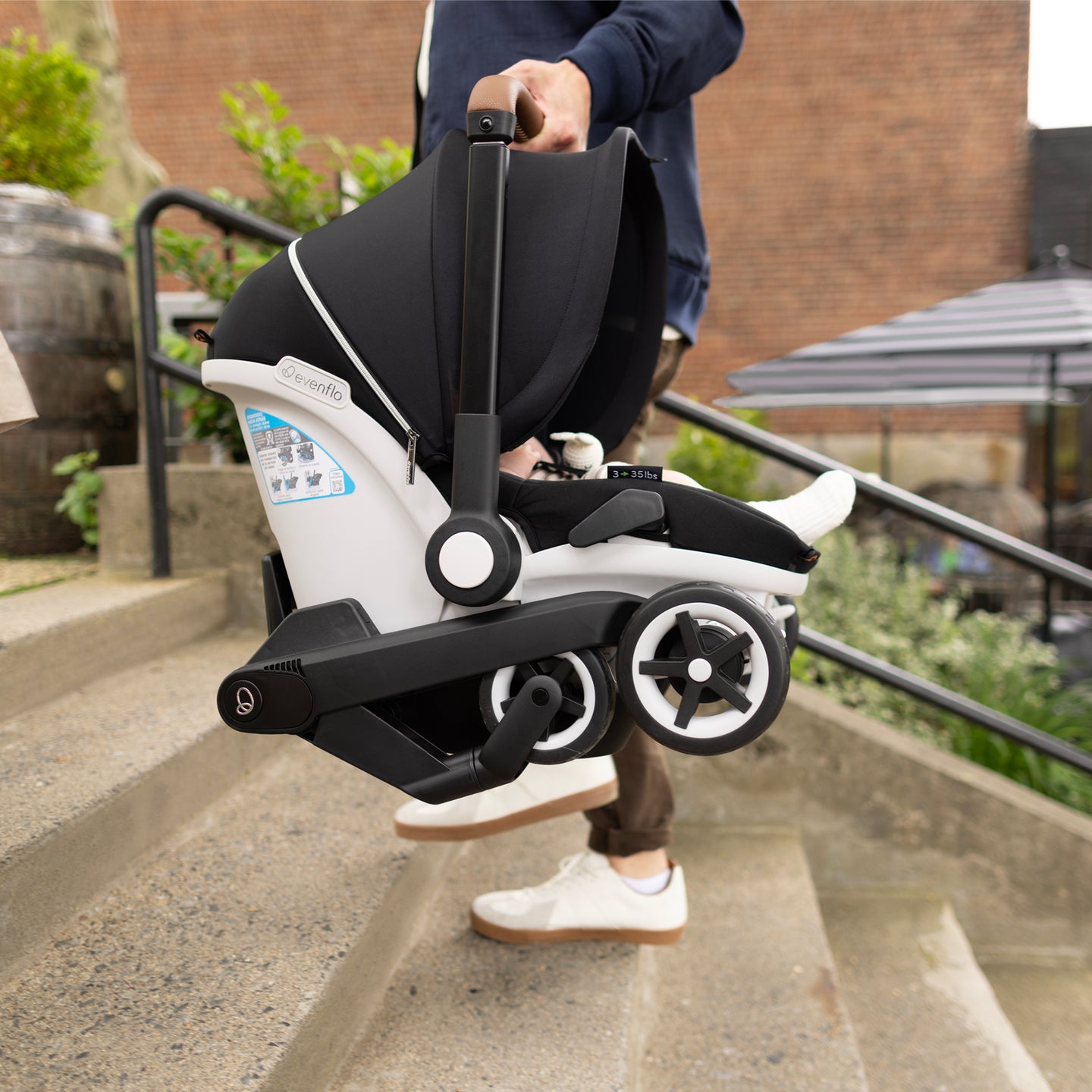 Evenflo - Gold Shyft DualRide with Carryall Storage Infant Car Seat and Stroller Combo - Onyx Black